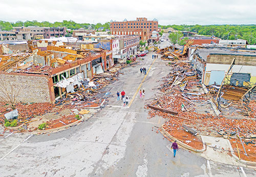 Damaged buildings are seen in Sulphur, Okla., on April 28 after the town was hit by a tornado the night before. Tornadoes killed at least four people in Oklahoma, including an infant, and left thousands without power after a destructive outbreak of severe weather flattened buildings in the heart of the rural town of Sulphur and injured at least 100 people across the state. (OSV News photo/Bryan Terry, The Oklahoman/USA Today Network via Reuters)