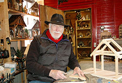 For more than 20 years, Ed Kirschner has been creating Nativity stables and Christmas memories in his small shop in Oldenburg. (Photo by John Shaughnessy)