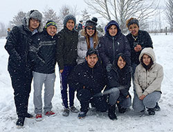 Members of St. Patrick Parish in Indianapolis pose on Jan. 23 in snow along the Pennsylvania Turnpike after the bus they had traveled on to the March for Life in Washington was stranded after traffic accidents ahead of them and a blizzard dumped three feet of snow in the region. The group from St. Patrick was part of a trip to Washington sponsored by the Indianapolis North Deanery. (Submitted photo)