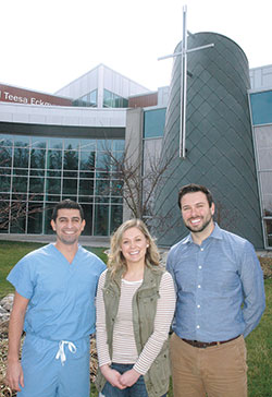 Tony Rohana, left, Katie Fiori and Matthew Wysocki are part of the first class of the Marian University College of Osteopathic Medicine in Indianapolis, a class that will graduate on May 7. (Photo by John Shaughnessy)