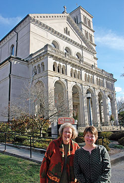 St. Joan of Arc parishioners Jean Zander, left, and Brenda Henry pose for a photo outside the north side Indianapolis church known for its striking sacred art and architecture—the springboard that the friends used to create Every Heart an Altar, their book of prayers and meditations designed to lead parishioners and non-parishioners to a deeper relationship with God. (Photo by John Shaughnessy)