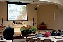 An image of the late Rev. Martin Luther King Jr. is displayed before a Jan. 18 program at Saint Joseph’s College. (Photo by Caroline B. Mooney)
