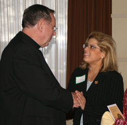 Archbishop Daniel M. Buechlein greets newly elected State Rep. Mara Candelaria Reardon of Munster, Ind. Rep. Candelaria Reardon is a member of the Indiana Commission on Hispanic and Latino Affairs. (Photo by Charles Schisla) 