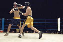 Hunter Land, left, battles Alex Duffy in the 2006 Bengal Bouts, an annual fundraiser at the University of Notre Dame which has raised $780,000 to help feed and educate people in Bangladesh. (Submitted photo) 