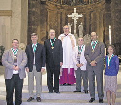 Six individuals recently received the St. John Bosco Medal. The awards were presented by Msgr. Joseph F. Schaedel, archdiocesan vicar general. From left are Paul Kervan, Bob Hasty, Father Robert Gilday, Msgr. Schaedel, Bob Tully, Brian Treece and Carol Pitzer.