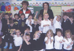 Standing at back, from left, rosary ladies Mary Anne Grande and Wilma Cook pose for a photo with Linnea Green’s kindergarten class at St. Michael School in Greenfield. (Submitted photo) 