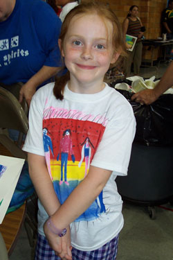 Cassady Cantu, a student at St. Philip Neri School in Indianapolis, shows off a T-shirt she created during the Great Spirits Camp in the summer of 2006 sponsored by the archdiocesan Catholic Urban School Consortium and St. Joan of Arc School in Indianapolis. Volunteers in the independent program Art with a Heart helped the students create the T-shirts. (Submitted photo) 