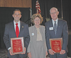 Right to Life of Indianapolis president Joan Byrum congratulates State Sen. Jeff Drozda of Westfield, Ind., left, and St. Luke parishioner John Hanagan of Indianapolis for their distinguished service to the cause of life during the organization’s 25th annual “Celebrate Life” dinner on Sept. 23 at the Indiana Convention Center in Indianapolis.