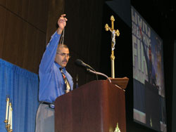 Lay evangelist Jesse Romero holds up a rosary during his presentation at “Lions Breathing Fire: Living the Catholic Faith.” The second annual Indiana Catholic Men’s Conference, sponsored by the Marian Center in Indianapolis, attracted more than 1,000 men from throughout the state on Sept. 22.