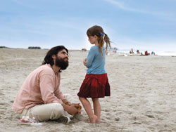 Actors Eduardo Verastegui and Sophie Nyweide face each other on a beach in this still photo taken from the 2007 movie Bella. (Photo courtesy of Metanoia Films) 