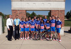 Daniel Elsener, Marian College president, left, cycling coach Dean Peterson and Joe Haklin, director of athletics, back row, far right, are pictured with members of the Franciscan college’s cycling team after they recently captured the school’s 10th national ­championship in 13 years. (Submitted photo) 