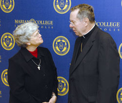Franciscan Sister Barbara Piller, congregational minister of the Sisters of St. Francis in Oldenburg, talks with Archbishop Daniel M. Buechlein at the Oct. 25 press conference in Indianapolis announcing the name change of Marian College to The Marian University. (Submitted photo) 