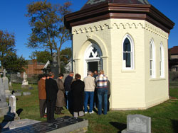 Madison-area Catholics stand outside the recently restored St. Patrick Cemetery chapel during the ­rededication ceremony and All Souls Day Mass on Nov. 2. The original crucifix, which is being restored in Cleveland, was donated to the parish by Mary Prenatt in the early 1900s. 