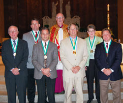 St. John Bosco Award recipients from Indianapolis pose for a photograph with Msgr. Joseph F. Schaedel, vicar general, after the Catholic Youth Organization Awards ceremony on May 8 at SS. Peter and Paul Cathedral in Indianapolis. They are, from left, St. Lawrence parishioner Tom O’Brien, St. Matthew parishioner John Sahm, St. Luke the Evangelist parishioner Dan Wagner, St. Joan of Arc parishioner Dr. Charles Hasbrook, Our Lady of Lourdes parishioner Colleen Kenney and St. Pius X parishioner Rob Doyle. St. Malachy parishioner Lori McFarland of Brownsburg was not able to attend the awards ceremony. (Submitted photo/courtesy CYO)