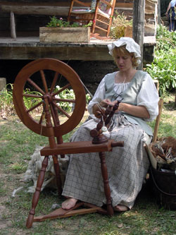 Kelly Kuchenbrod of Evansville, Ind., a volunteer at O’Bannon Woods State Park, demonstrates how wool yarn is created with a traditional spinning wheel. (Photo by Patricia Happel Cornwell)