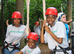 Providence Cristo Rey High School students, left, Breonna Jones, Samoya Heard and Simone Heard prepare for the high-ropes course at Butler University in Indianapolis. The fitness course was part of team-building training for Providence Cristo Rey’s corporate work-study program. (Submitted photo) 
