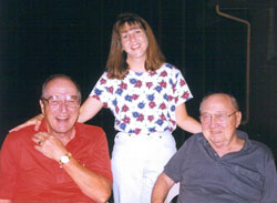 Father J. Joseph McNally, left, and the late Father John Sciarra, the founding pastor of St. Barnabas Parish, pose for a picture with parish secretary Theresa Warner of Indianapolis on July 4, 2000. The parish’s Sciarra Center includes the gymnasium, the Atrium and McNally Hall, a large meeting and reception room. (Submitted photo) 