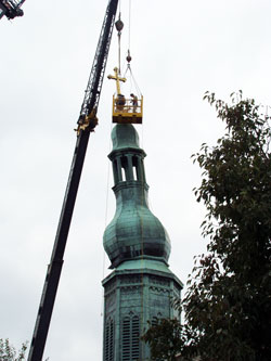 Workers use a crane to assess the damage to the steeple at St. Mary Church in New Albany on Sept. 15. (Submitted photo) 