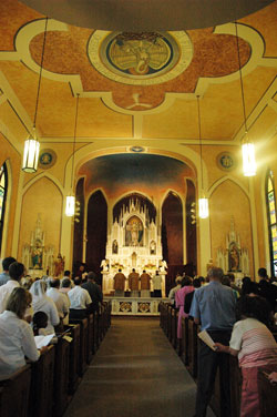 Some 200 worshippers pray during a solemn high traditional Latin Mass celebrated on Sept. 5 at SS. Philomena and Cecilia Church in Oak Forest in the Batesville Deanery to celebrate the completion of the restoration of much of the church’s interior decoration. (Photo by Sean Gallagher) 