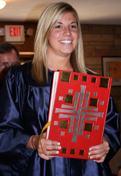 Abigail Lilly, a 2008 graduate of Our Lady of Providence Jr./Sr. High School in Clarksville, carries the Lectionary to begin the processional for her senior class baccalaureate ceremony, which was held in May at Our Lady of Perpetual Help Church in New Albany. (Submitted photo) 