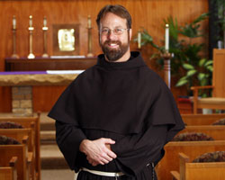 Conventual Franciscan Brother John Bamman, a native of Toledo, Ohio, poses for a picture in the chapel at St. Joseph Cupertino Friary in Prior Lake, Minn., where he is preparing for his ordination as a transitional deacon in 2009 and his ordination to the priesthood in 2010. He has assisted with youth retreats at Mount St. Francis Retreat Center in southern Indiana. (Photo by Dave Hrbacek/The Catholic Spirit) 