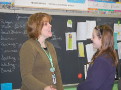 Colleen Burdette, left, shares a fun teaching moment with Megan Whitham, a student at Pope John XXIII School in Madison. Burdette is a sixth-grade teacher at the school. (Submitted photo) 