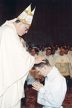 Archbishop Timothy M. Dolan of Milwaukee ordains then-seminarian Jonathan Meyer as a transitional deacon on Oct. 9, 2002, at St. Peter’s Basilica in Rome. Archbishop Dolan had been the rector of the Pontifical North American College in Rome during the first two years of now-Father Meyer’s priestly formation there. On Feb. 23, Pope Benedict XVI appointed Archbishop Dolan to lead the Archdiocese of New York. (Submitted photo) 
