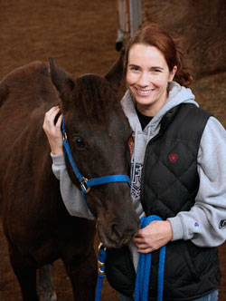 After moving from California three years ago, Jennifer Steager has found a new path in life as a student at Saint Mary-of-the-Woods College, where she has drawn closer to God and begun to live her dream as a horse owner by adopting a wild mustang named Indigo. (Photo by Lynn Hughes) 