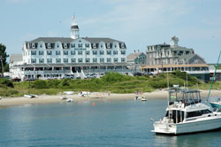 As the Block Island Ferry nears the dock at Old Harbor, tourists can see the historic National Hotel and other clapboard buildings that line the coast. The island became part of the colony of Rhode Island in 1672, and was originally named “New Shoreham.” A Dutch map that dates back to 1685 identifies the island as “Adriaen Blocks Eylant” for Dutch explorer Adrian Block. (Photo by Mary Ann Wyand) 
