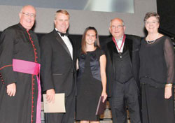 Msgr. Joseph F. Schaedel, left, vicar general; Daniel Elsener, president of Marian University in Indianapolis; Kali Genos, a Marian student; Jerry Semler; and Karen Ristau, president of the National Catholic Educational Association (NCEA), pose on Oct. 4 in Washington after a ceremony during which Semler received a St. Elizabeth Ann Seton Award, the NCEA’s highest honor. (Submitted photo) 