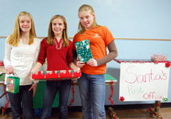 Sixth-grade students at St. Mary School in Greensburg have focused on doing random acts of kindness in their school and community during this school year. Bailey Schroeder, from left, Kasey Moeller and Maddy Schroeder led an effort among their classmates to raise money for a family in need at Christmas. (Photo courtesy of Greensburg Daily News)