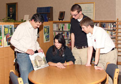 David Marsee, left, talks with Jenna Kolb, Joe Linginfelter and Joel Stocksdale, all juniors at Seton Catholic High School in Richmond, about a watercolor painting that he created of St. Mary Church in Richmond on the occasion of the parish’s recent 150th anniversary. Marsee is a member of St. Andrew Parish in Richmond, and volunteers at Seton Catholic High School. (Photos by James Stephenson)