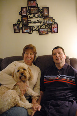 St. Thomas Aquinas parishioners Kathy and Bob Carroll of Indianapolis enjoy time together at home on March 25 with their dog, Emma. She is a registered nurse and one of the presenters for a caregivers retreat on April 22 at the Benedict Inn Retreat and Conference Center in Beech Grove. (Photo by Mary Ann Wyand)