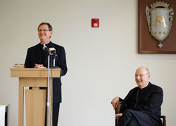 Bishop-designate Timothy L. Doherty addresses the media and others gathered for a May 12 news conference at the Cathedral of St. Mary of the Immaculate Conception in Lafayette announcing his appointment as the new bishop of the Diocese of Lafayette, Ind. Seated is retiring Bishop William L. Higi of the Diocese of Lafayette. (Photo courtesy The Catholic Moment)