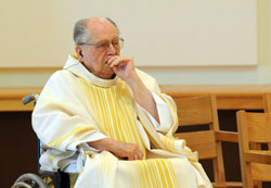 Retired Father Hilary Meny concelebrates a Mass on June 23 at the Archabbey Church of Our Lady of Einsiedeln in St. Meinrad during a convocation of archdiocesan priests held there. During the meeting, Father Meny was honored for his 70 years of priestly life and ministry. (Photo courtesy of Saint Meinrad Archabbey)