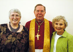 Becky Cope, left, and Mary Margaret Lynch, right, pose with Archbishop Daniel M. Buechlein on Sept. 20 in the rectory of SS. Peter and Paul Cathedral in Indianapolis after the two lay ministers were honored for completing the archdiocese’s Ecclesial Lay Ministry program. Cope ministers at Our Lady of the Greenwood Parish in Greenwood. Lynch ministers at St. Joseph Parish in Shelbyville. (Photo by Sean Gallagher)
