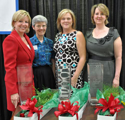 Benedictine Sister Carol Falkner, second from left, the administrator of the Benedict Inn Retreat and Conference Center in Beech Grove, poses for a photograph on Sept. 25 with Angels of Grace Award recipients, from left, Anne Ryder, Julie Molloy and Caroline Fisher, all of Indianapolis. (Photo by Mary Ann Wyand)