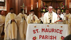 Archbishop Daniel M. Buechlein prays the eucharistic prayer and is joined by several concelebrating priests during an Oct. 22 Mass at St. Maurice Church in Decatur County to celebrate the 150th anniversary of the founding of the Batesville Deanery parish. (Submitted photo)