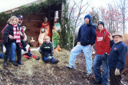 Henry Von Essen, right, poses with members of his extended family last December after they put up a Nativity scene at St. Michael Parish in Greenfield for the 50th consecutive year. Posing with him before the Nativity are, from left, Vanessa, Larry, Joseph and Tony Von Essen, and Tim and Steve Kottlowski. (Submitted photo)