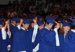 Bishop Chatard High School seniors take part in the “turning of the tassel,” which symbolizes a student’s transition from candidate to graduate, during graduation ceremonies on May 23, 2010, at the Indianapolis North Deanery interparochial high school. Nearly 1,300 students will graduate from area Catholic schools in the next few weeks. (Submitted photo)