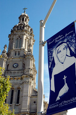 A banner of St. Theodora Guérin is displayed outside the Church of the Immaculate Conception at Saint Mary-of-the-Woods. She was canonized on Oct. 15, 2006, by Pope Benedict XVI. (File photo by Mary Ann Wyand)