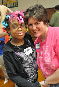 Brittany Belton, left, and Jennifer Toler, both of Indianapolis, pose for a photograph during the “Special Night Out” party on June 7 at the Archbishop O’Meara Catholic Center in Indianapolis. (Photo by Mary Ann Wyand)