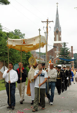 Members of Holy Family Parish in Oldenburg participate in a Corpus Christi procession on May 24, 2006, along the streets of the southeastern Indiana town. The procession has been an annual tradition of the parish since 1846. (File photo by Mary Ann Garber)