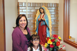 Esmeralda Gomez and her daughter, Aylee, feel fortunate that the Indiana school voucher program and the generosity of donors in the archdiocese have made it possible for the girl to attend St. Philip Neri School in Indianapolis. (Photo by John Shaughnessy)
