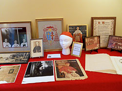 A collection of memorabilia from Cardinal Joseph E. Ritter’s ministry in the Church is displayed in the renovated museum room of the Cardinal Ritter House in New Albany. The room was formerly the kitchen of the cardinal’s family bakery. (Photo by Patricia Happel Cornwell)