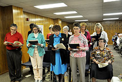 The graduating class of the Benedict Inn’s Spiritual Direction Internship program recites a prayer at the end of their graduation ceremony at the Benedict in Retreat and Conference Center in Beech Grove on April 25. Front row, from left: John Hosier, Donna Wenstrup, Mary Ellen Allig, Leslie Miskowiec and Benedictine Sister Julie Sewell. Back row: Father Ben Okonkwo, Barb Dahl, Judy Fackenthal, Ann Littlefield and Melissa Jackson. Graduates Cindy Sturgeon and Deb Doty are not pictured. (Photo by Natalie Hoefer)