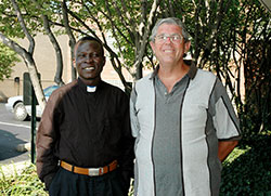 Sudanese Father Alfred Loro Caesar, left, and Comboni Father Michael Barton pose outside the Archbishop Edward T. O’Meara Catholic Center in Indianapolis in this 2007 file photo. (File photo by Mary Ann Garber)