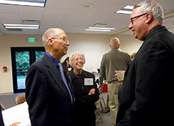 Stephen and Judy Cecil, members of St. Bartholomew Parish in Columbus, chat with Bishop Christopher J. Coyne at the reception following the Miter Society Mass on Oct. 7. (Photo by Patricia Happel Cornwell)	