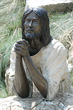 This bronze sculpture of Jesus praying is among the statues on display at the Shrine of Christ’s Passion in St. John, Ind. (Criterion file photo)
