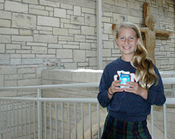 Drinking a glass of milk inspired Caroline Caito, a sixth-grade student at Immaculate Heart of Mary School in Indianapolis, to write a touching prayer that won a national contest. (Photo by John Shaughnessy)